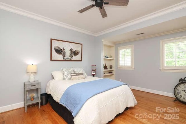 1103 Mapesbury Ln, Waxhaw, NC 28173 - bedroom with wood finished floors, ornamental molding, baseboards, and ceiling fan