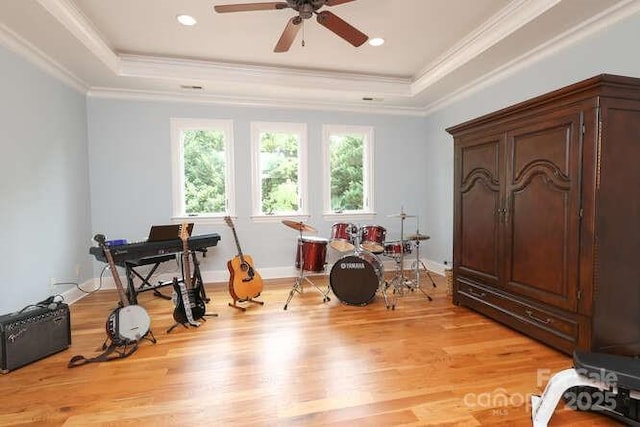 1103 Mapesbury Ln, Waxhaw, NC 28173 - game room with a raised ceiling, light wood-style flooring, ceiling fan, ornamental molding, and recessed lighting