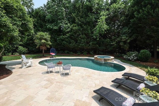 1103 Mapesbury Ln, Waxhaw, NC 28173 - view of swimming pool featuring a patio and a pool with connected hot tub