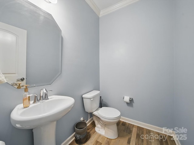 11225 Island View Ln, Lancaster, SC 29720 - bathroom featuring crown molding, toilet, wood finished floors, and baseboards