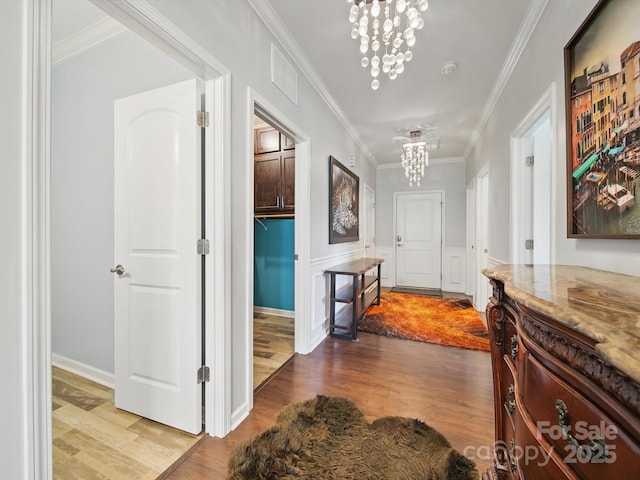 11225 Island View Ln, Lancaster, SC 29720 - hall with a chandelier, wood finished floors, crown molding, and wainscoting