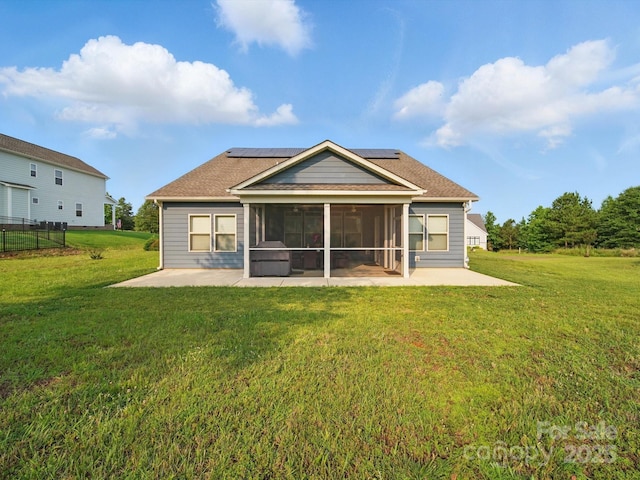11225 Island View Ln, Lancaster, SC 29720 - back of house with a patio area, a sunroom, solar panels, and a yard