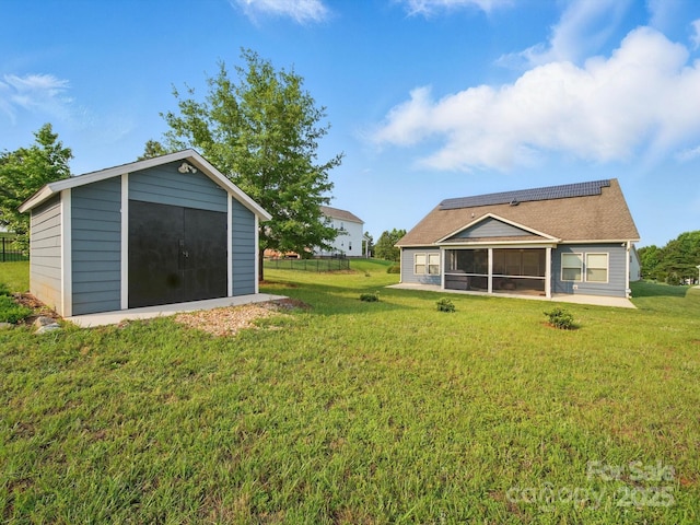 11225 Island View Ln, Lancaster, SC 29720 - view of green lawn featuring a sunroom and an outbuilding