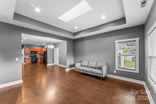 6 Meeting St, Asheville, NC 28803 - unfurnished living room with a tray ceiling, baseboards, dark wood-style floors, and recessed lighting