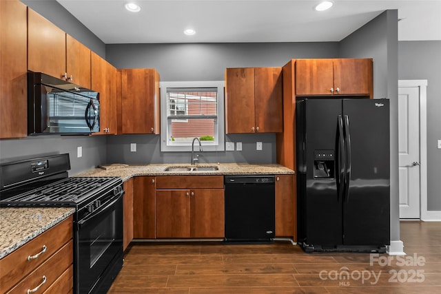 6 Meeting St, Asheville, NC 28803 - kitchen with black appliances, a sink, light stone countertops, dark wood-style floors, and recessed lighting