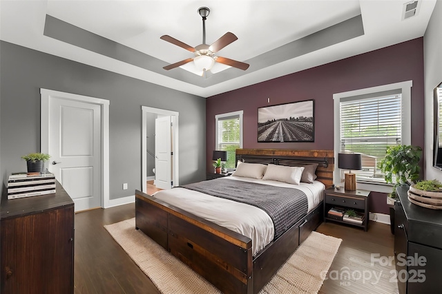 6 Meeting St, Asheville, NC 28803 - bedroom with a tray ceiling, wood finished floors, baseboards, and a ceiling fan