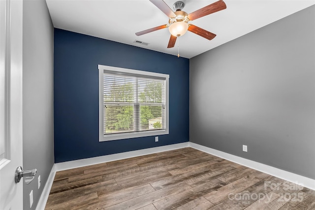 6 Meeting St, Asheville, NC 28803 - spare room with wood finished floors, a ceiling fan, and baseboards