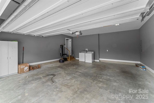 6 Meeting St, Asheville, NC 28803 - garage featuring a garage door opener, washing machine and dryer, and baseboards