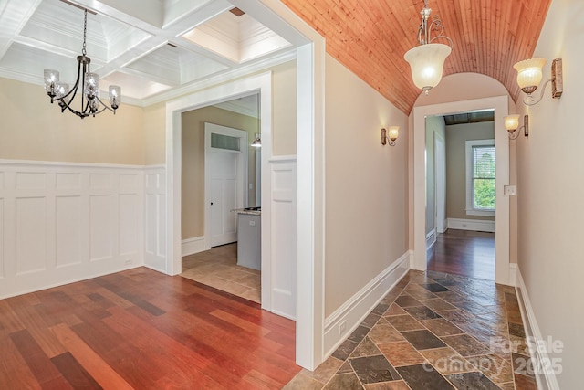 135 Waycross Dr, Rockwell, NC 28110 - hall featuring a chandelier, crown molding, a wainscoted wall, baseboards, and wood ceiling with exposed beams