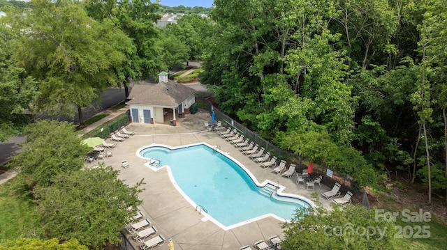 10455 Alexander Martin Ave, Charlotte, NC 28277 - community pool featuring a patio and view of scattered trees
