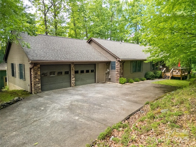 500 Cheestoonaya Way, Brevard, NC 28712 - view of front of property featuring an attached garage, concrete driveway, a shingled roof, and stone siding