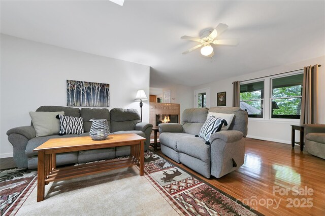 500 Cheestoonaya Way, Brevard, NC 28712 - living room with baseboards, a ceiling fan, wood finished floors, and a fireplace