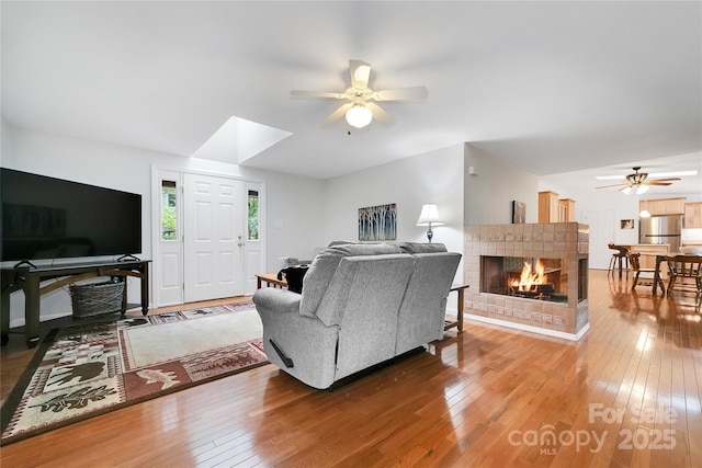 500 Cheestoonaya Way, Brevard, NC 28712 - living area with ceiling fan, hardwood / wood-style flooring, and a tile fireplace