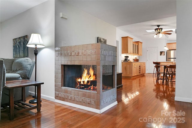 500 Cheestoonaya Way, Brevard, NC 28712 - living room with hardwood / wood-style floors, a tile fireplace, ceiling fan, and baseboards