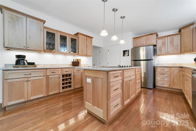 500 Cheestoonaya Way, Brevard, NC 28712 - kitchen with freestanding refrigerator, light brown cabinetry, light wood-style flooring, and glass insert cabinets