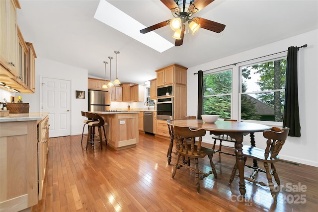 500 Cheestoonaya Way, Brevard, NC 28712 - dining room featuring lofted ceiling, light wood-style flooring, ceiling fan, and baseboards
