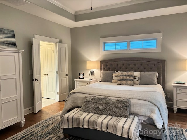 1636 Sand Harbor Cir, Ocean Isle Beach, NC 28469 - bedroom featuring dark wood finished floors, ornamental molding, and baseboards