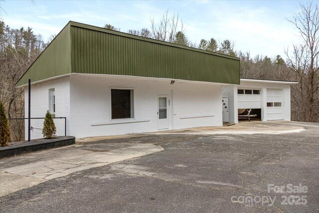 2599/2611 Old Mars Hill Hwy, Weaverville, NC 28787 - view of front of property with a garage and concrete block siding