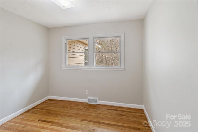 2599/2611 Old Mars Hill Hwy, Weaverville, NC 28787 - unfurnished room with light wood-style flooring and baseboards