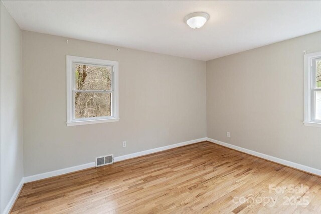 2599/2611 Old Mars Hill Hwy, Weaverville, NC 28787 - unfurnished room with light wood-style flooring and baseboards