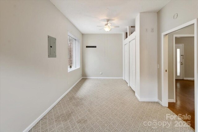 2599/2611 Old Mars Hill Hwy, Weaverville, NC 28787 - carpeted empty room with ceiling fan, electric panel, and baseboards