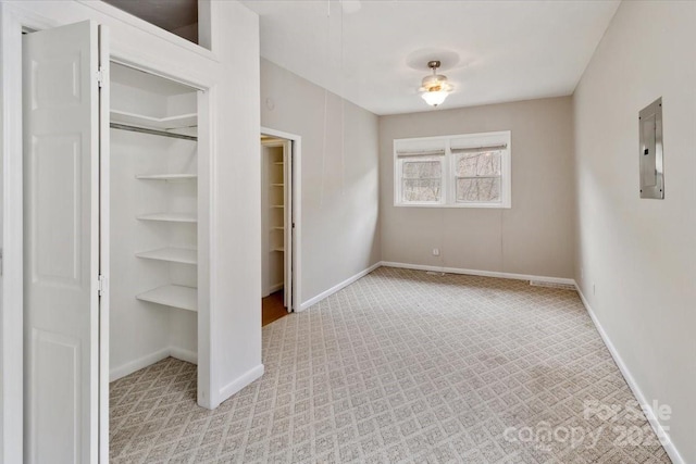 2599/2611 Old Mars Hill Hwy, Weaverville, NC 28787 - unfurnished bedroom with electric panel, baseboards, a closet, and light colored carpet