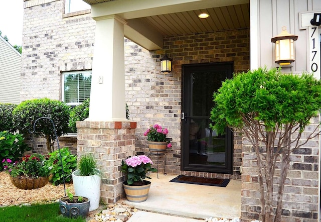 7170 Kenyon Dr, Denver, NC 28037 - view of exterior entry featuring brick siding and covered porch