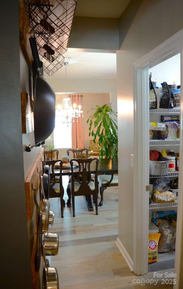 7170 Kenyon Dr, Denver, NC 28037 - dining space with wood finished floors and a chandelier