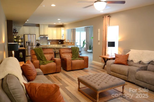 7170 Kenyon Dr, Denver, NC 28037 - living room featuring light wood-type flooring, ceiling fan, recessed lighting, and baseboards