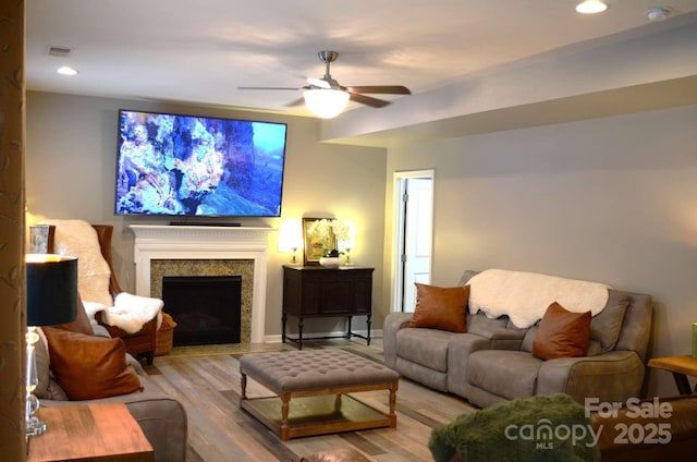 7170 Kenyon Dr, Denver, NC 28037 - living room featuring wood finished floors, a ceiling fan, recessed lighting, a fireplace, and baseboards