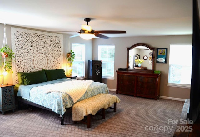 7170 Kenyon Dr, Denver, NC 28037 - carpeted bedroom featuring multiple windows, baseboards, and ceiling fan