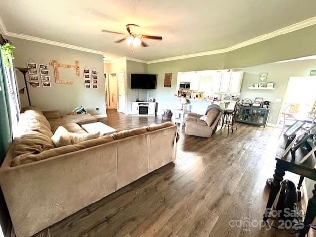1545 Lewis Farm Rd, Kings Mountain, NC 28086 - living area featuring dark wood finished floors, a ceiling fan, and ornamental molding