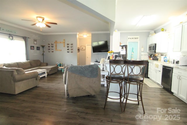1545 Lewis Farm Rd, Kings Mountain, NC 28086 - kitchen with stainless steel microwave, dishwashing machine, a ceiling fan, white cabinets, and dark wood-style flooring