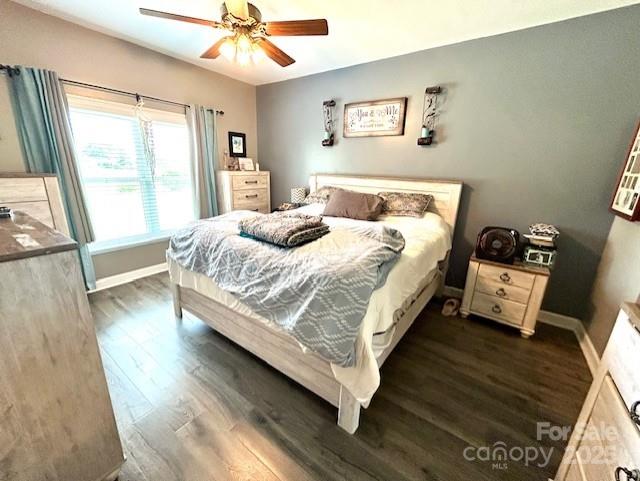 1545 Lewis Farm Rd, Kings Mountain, NC 28086 - bedroom with wood finished floors, baseboards, and a ceiling fan
