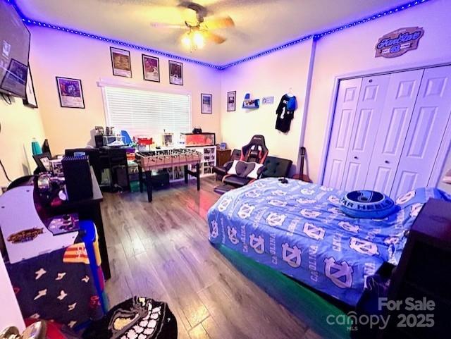 1545 Lewis Farm Rd, Kings Mountain, NC 28086 - bedroom with wood finished floors, a ceiling fan, and a closet