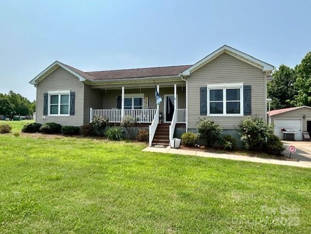 1545 Lewis Farm Rd, Kings Mountain, NC 28086 - single story home with covered porch, a front lawn, an outdoor structure, and a detached garage