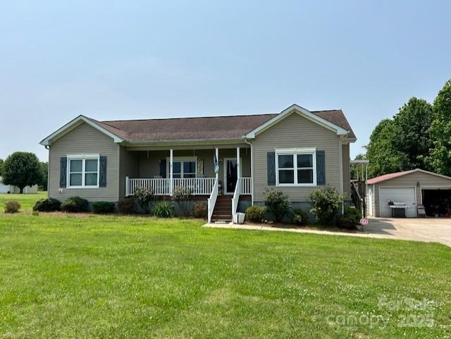 1545 Lewis Farm Rd, Kings Mountain, NC 28086 - ranch-style home featuring covered porch, an outdoor structure, a detached garage, and a front yard