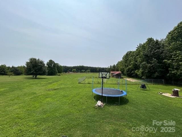 1545 Lewis Farm Rd, Kings Mountain, NC 28086 - view of grassy yard with a trampoline