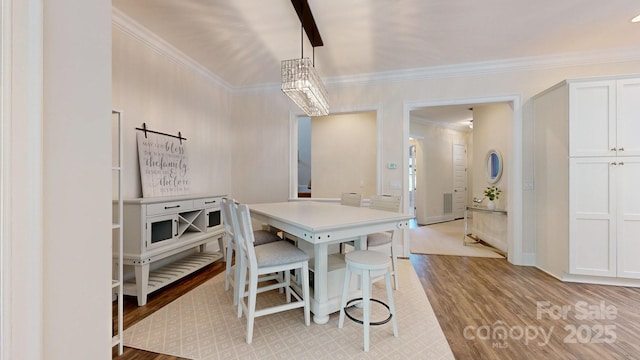5590 Elk Knob Ct, Denver, NC 28037 - dining space with ornamental molding and light wood-style flooring