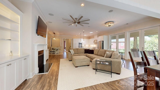 5590 Elk Knob Ct, Denver, NC 28037 - living area with ornamental molding, ceiling fan, wood finished floors, recessed lighting, and a fireplace