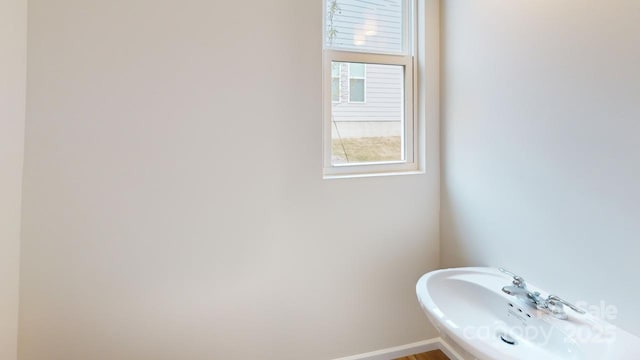 2547 Ruby Dixon Crossing Dr Unit 17, Gastonia, NC 28056 - bathroom with baseboards and a sink