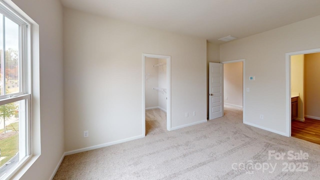 2547 Ruby Dixon Crossing Dr Unit 17, Gastonia, NC 28056 - unfurnished bedroom with carpet flooring, a walk in closet, and a closet