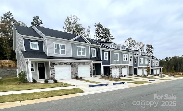 2547 Ruby Dixon Crossing Dr Unit 17, Gastonia, NC 28056 - multi unit property featuring an attached garage, stone siding, and driveway
