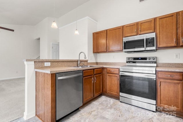4714 Adamshire Ave, Concord, NC 28025 - kitchen with appliances with stainless steel finishes, a sink, brown cabinets, a peninsula, and light countertops
