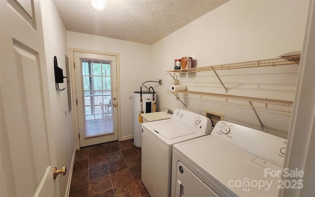 253 Nors Way Unit 26, Lake Lure, NC 28746 - laundry room featuring separate washer and dryer, stone finish floors, electric water heater, a textured ceiling, and baseboards