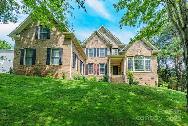 1868 Chestnut Hill Dr, Tega Cay, SC 29708 - traditional-style house with brick siding and a front lawn