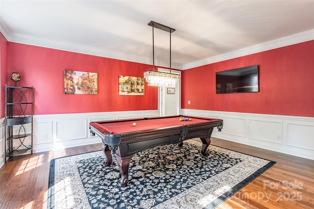 1868 Chestnut Hill Dr, Tega Cay, SC 29708 - rec room with crown molding, billiards, a wainscoted wall, wood finished floors, and a decorative wall
