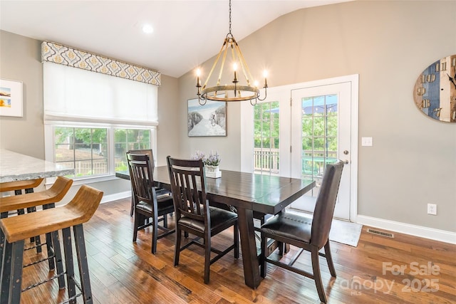 1868 Chestnut Hill Dr, Tega Cay, SC 29708 - dining area featuring vaulted ceiling, a chandelier, hardwood / wood-style flooring, and baseboards