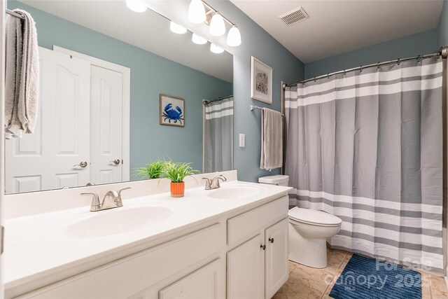 1868 Chestnut Hill Dr, Tega Cay, SC 29708 - full bathroom featuring toilet, double vanity, and a shower with shower curtain