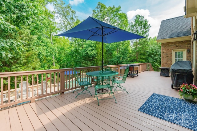 1868 Chestnut Hill Dr, Tega Cay, SC 29708 - wooden deck with a jacuzzi, outdoor dining area, and area for grilling